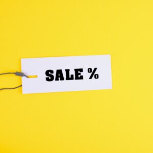 A discount sale tag on a yellow background